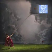 THIS MUSIC MAY CONTAIN HOPE. – RAYE
